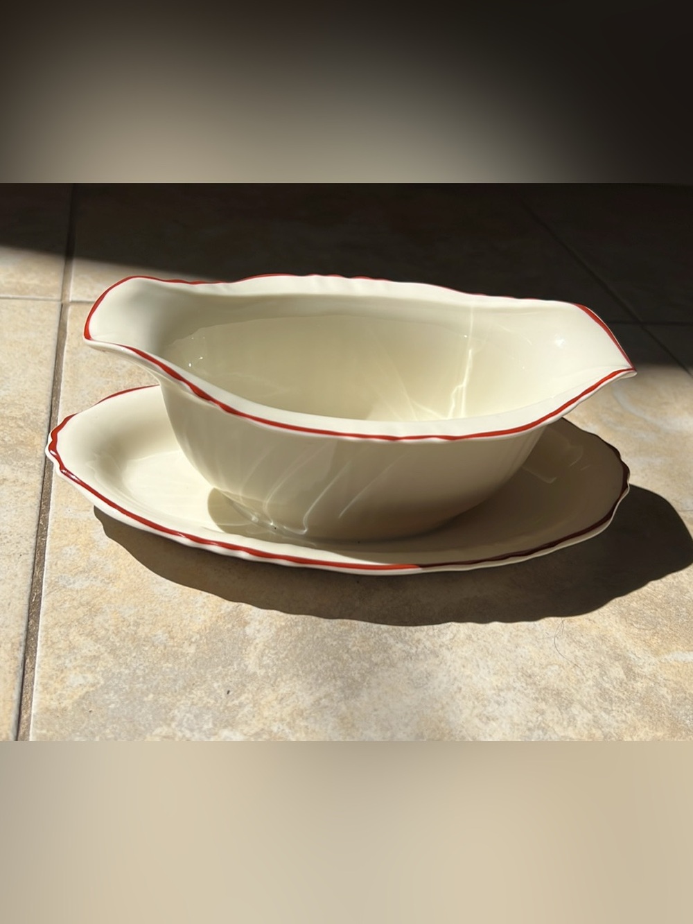 Vintage Syracuse China gravy boat with an attached underplate